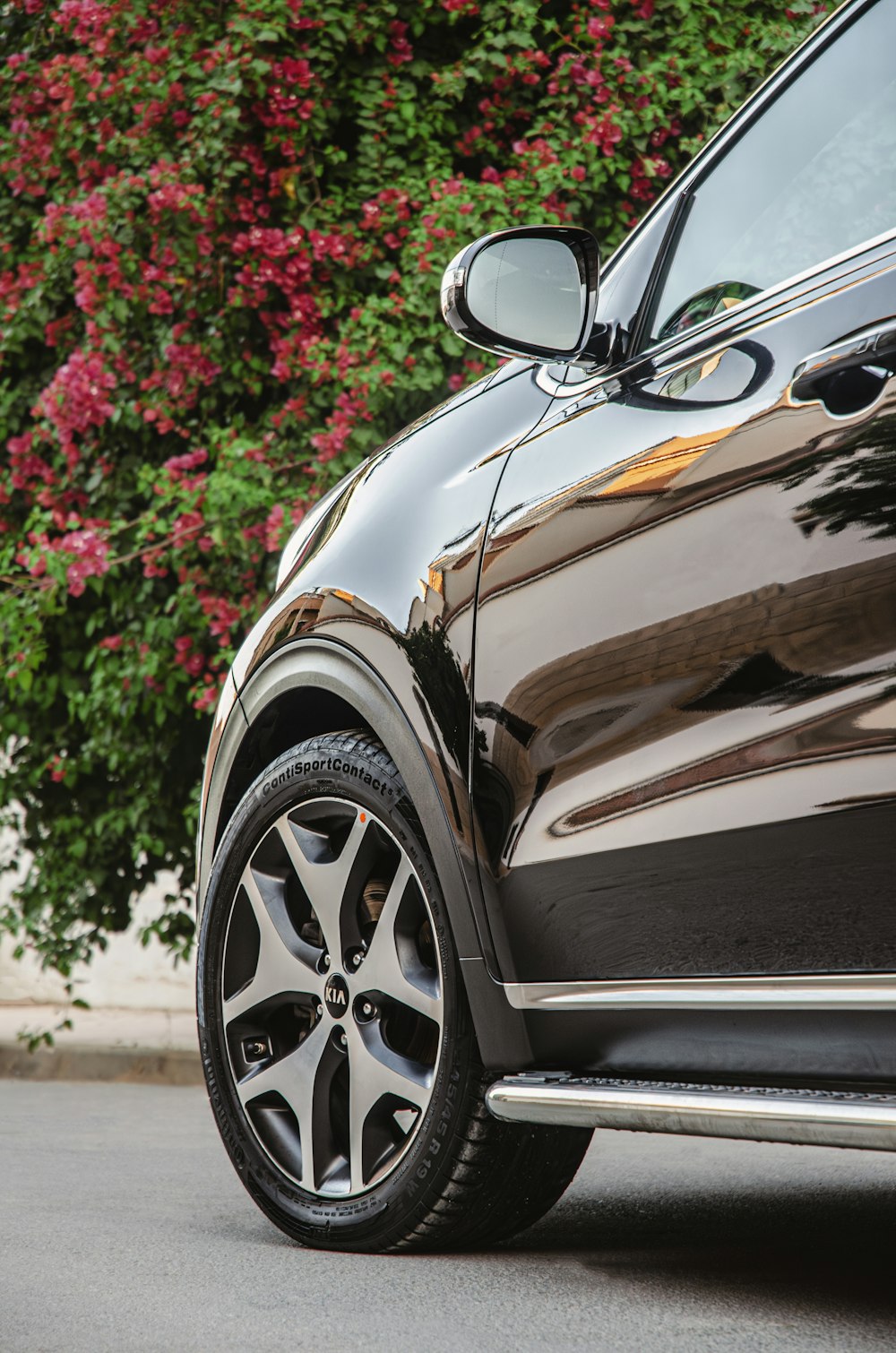 a close up of a car parked on the side of the road