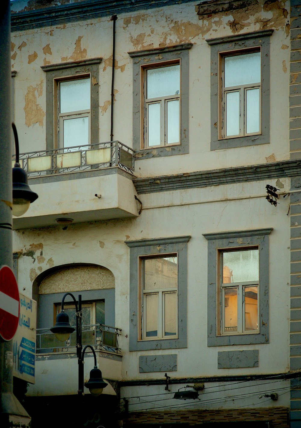 an old building with a street sign in front of it