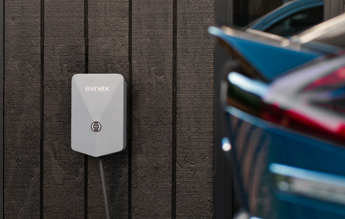 48 amp Level 2 charger on a garage wall in Ford, with the load calc that made it legal
