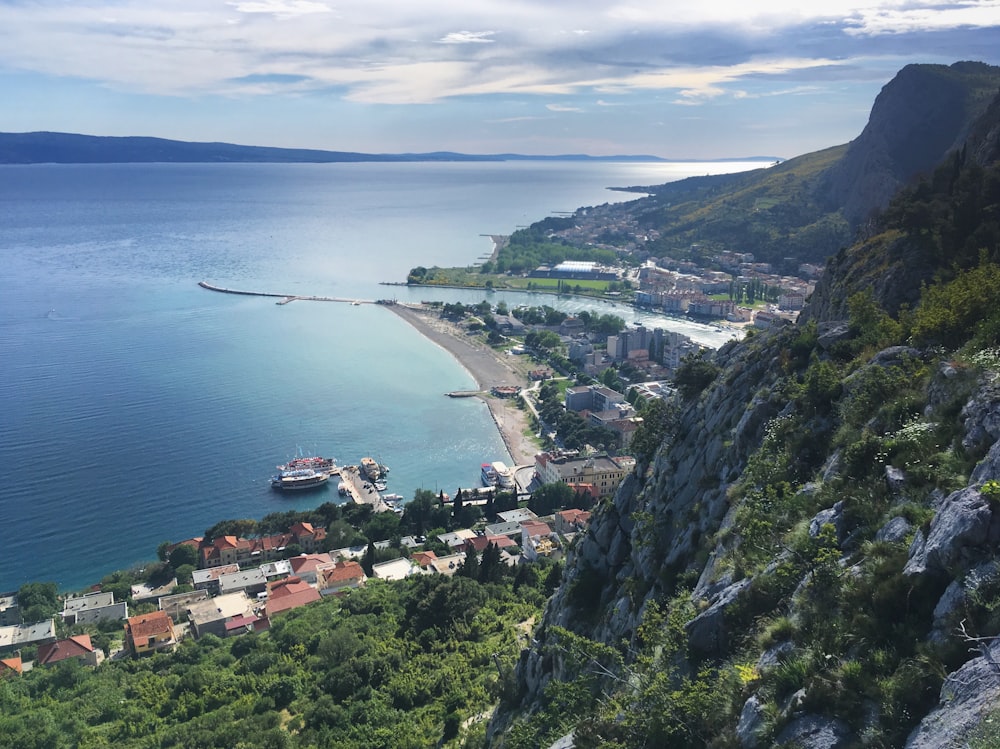 a scenic view of a small town on the edge of a cliff