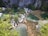 A scenic view of a lush tropical landscape in Bali with a winding path.