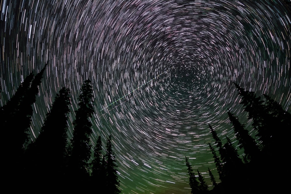 a star trail is seen in the night sky