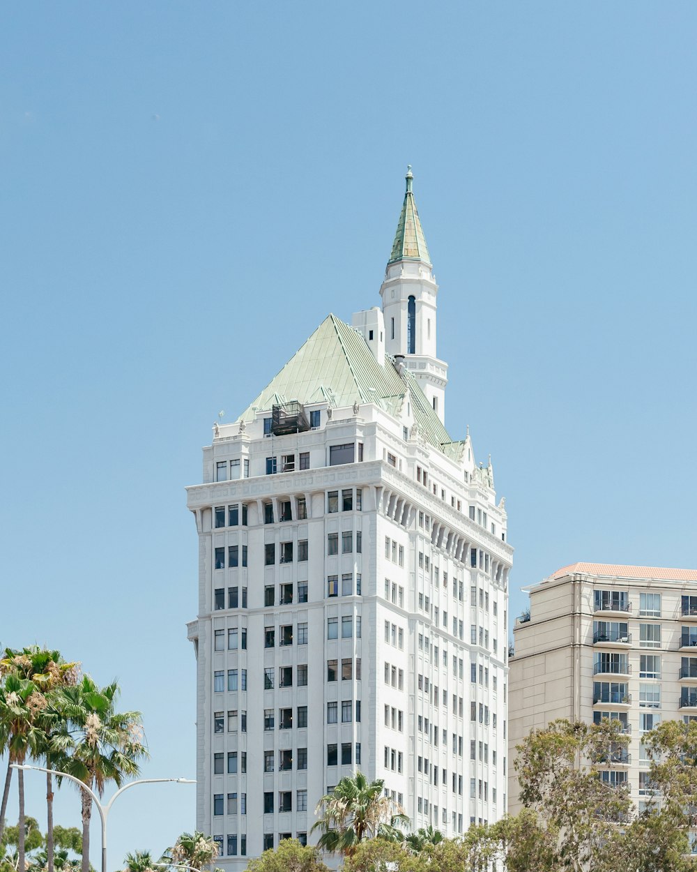 a tall white building with a steeple on top