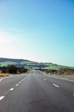 A family enjoying a road trip on an open highway in Ohio, showcasing peace of mind.