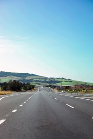 A family enjoying a road trip on an open highway in Ohio, showcasing peace of mind.
