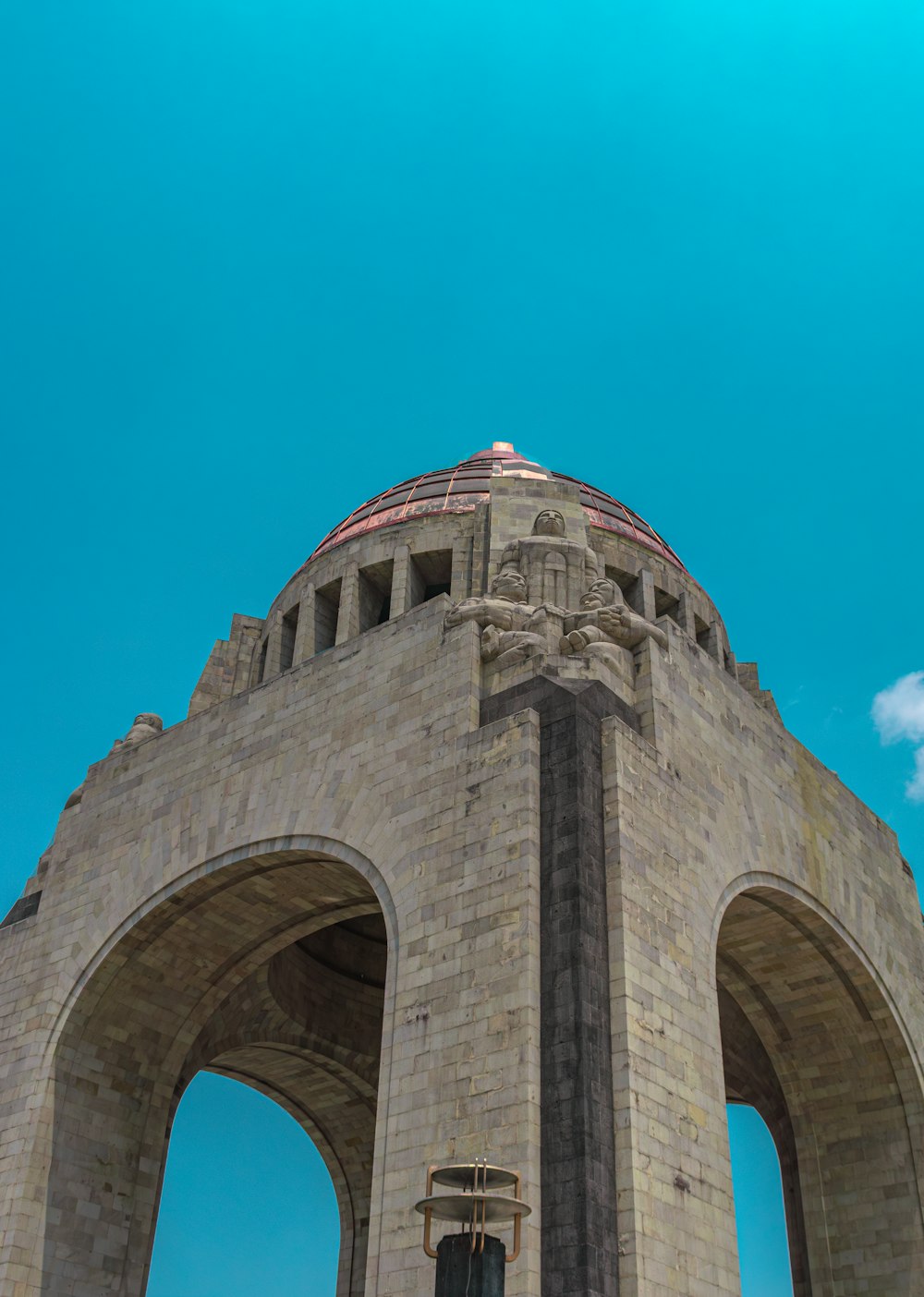 a large stone structure with a clock on top of it