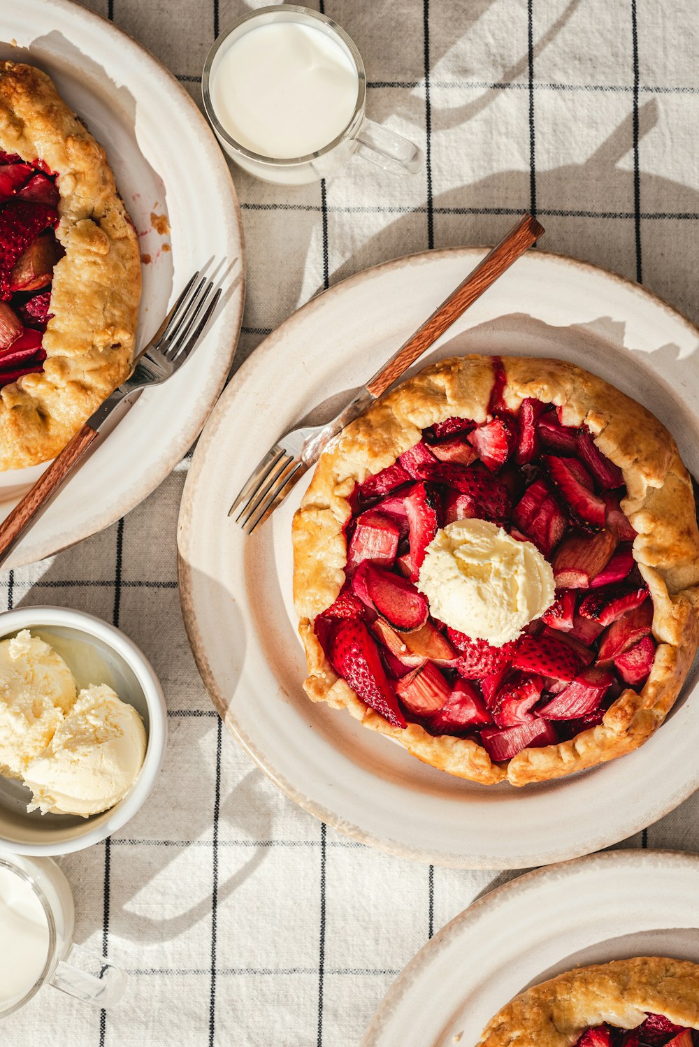 a strawberry pie with whipped cream on top