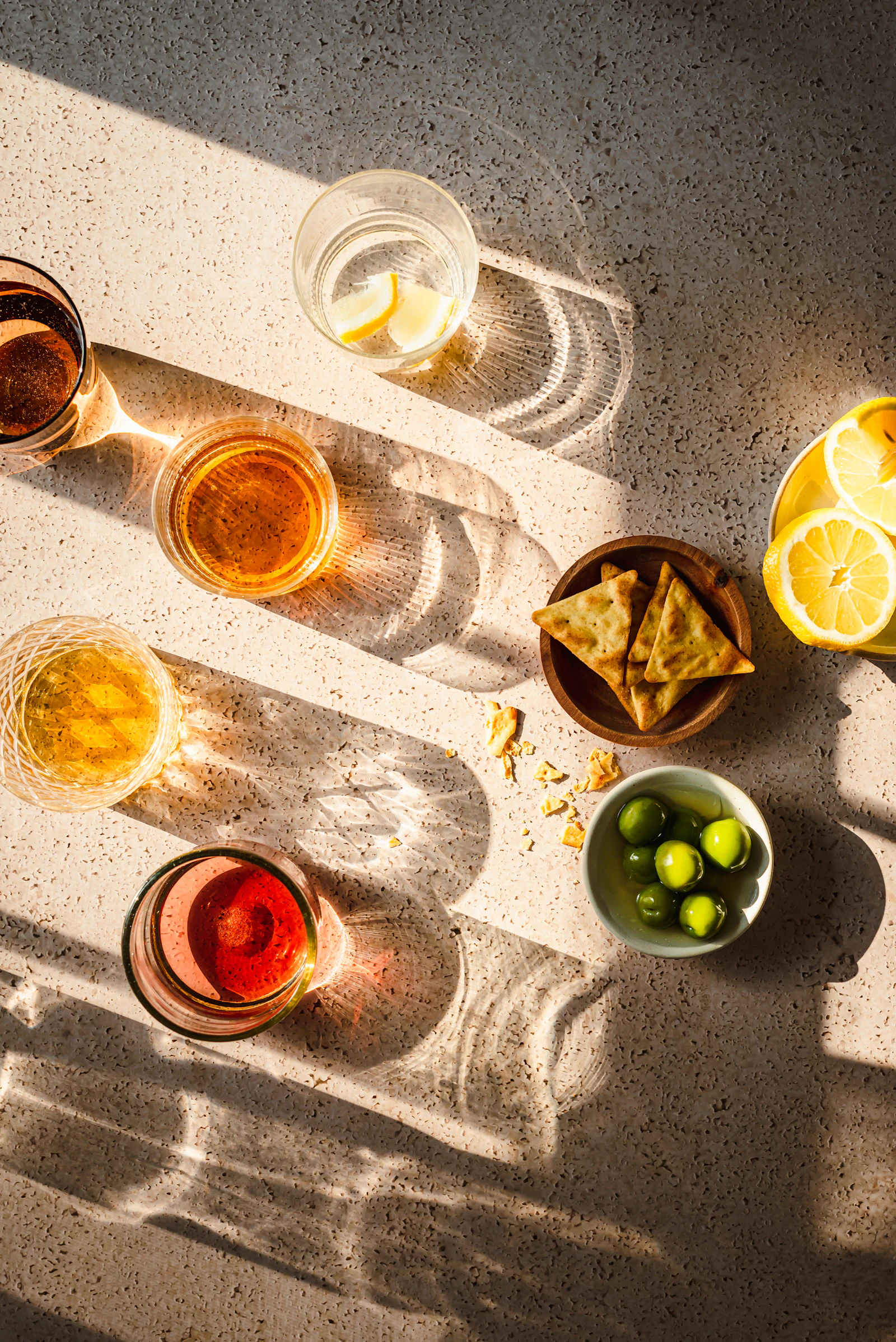A colorful table filled with fresh dishes and drinks