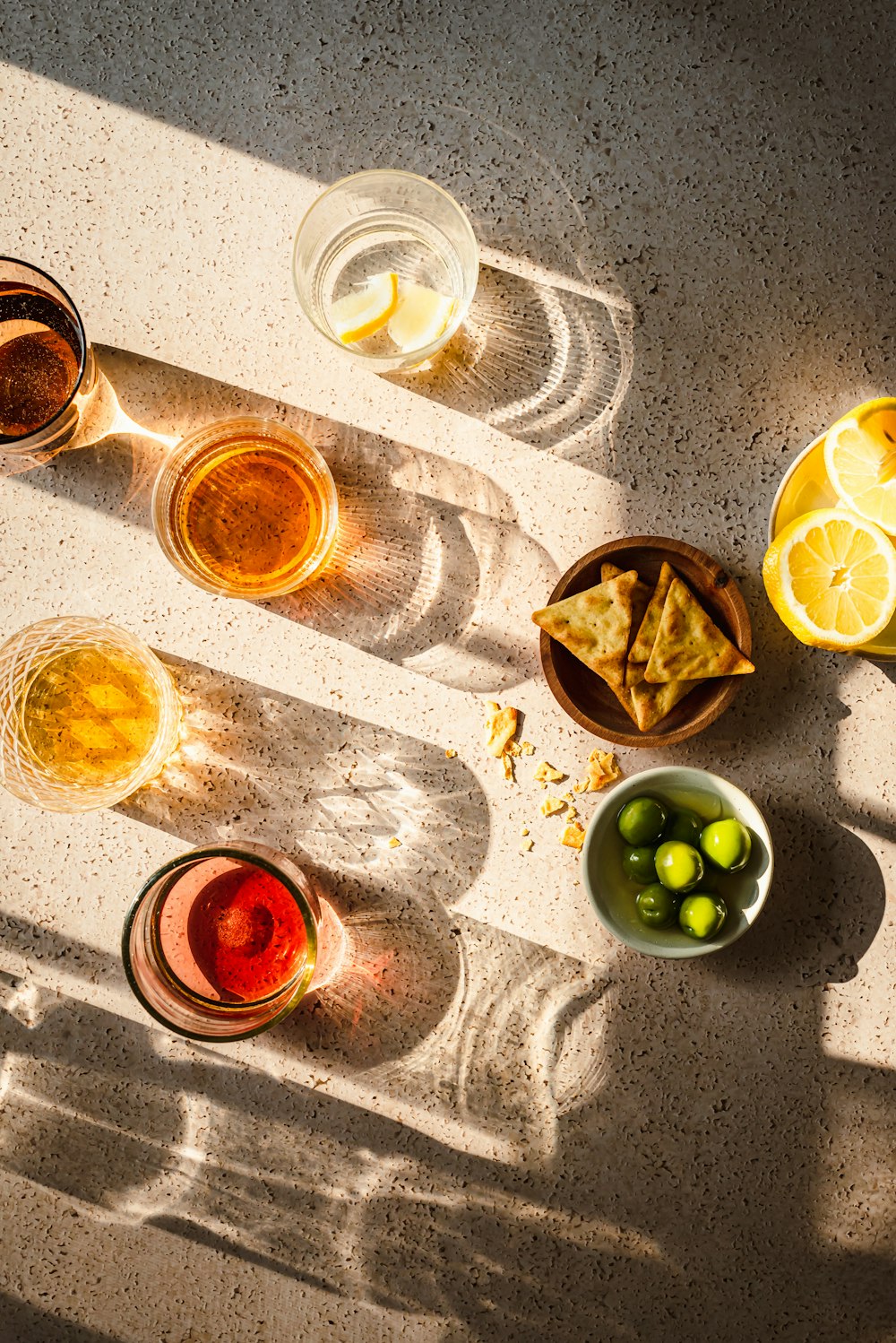 a table topped with bowls of food and drinks