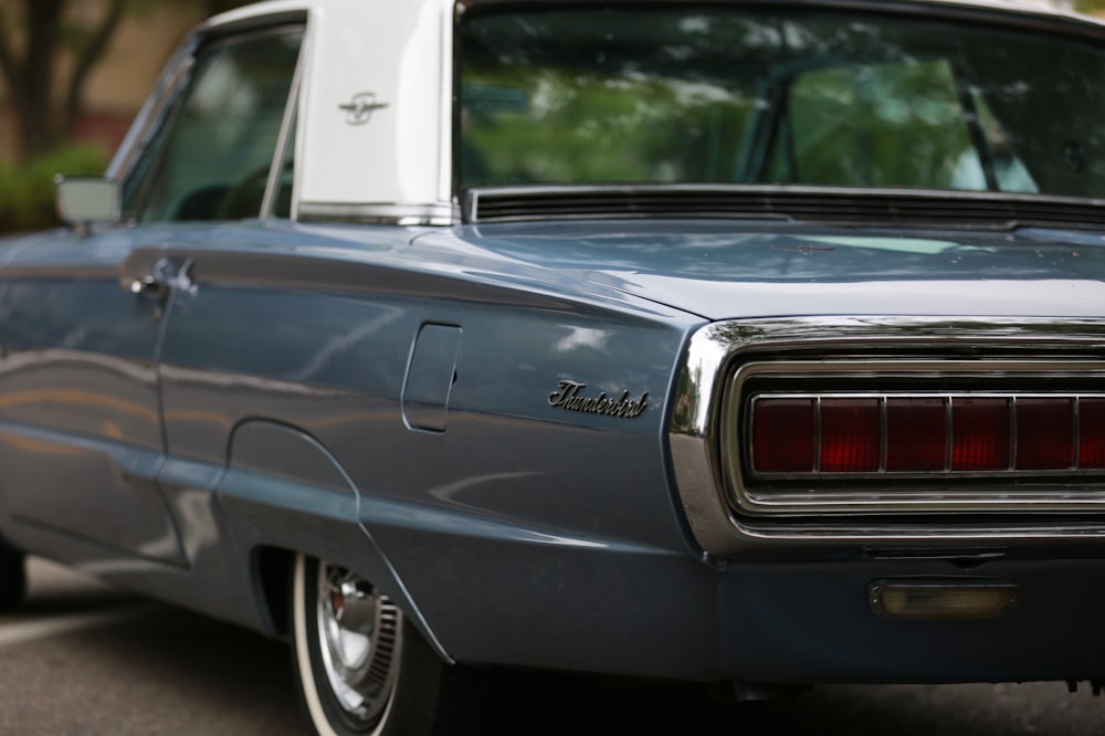 a blue car parked on the side of the road