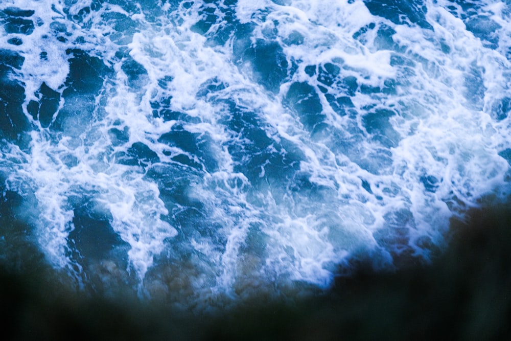 a view of the ocean from the top of a cliff