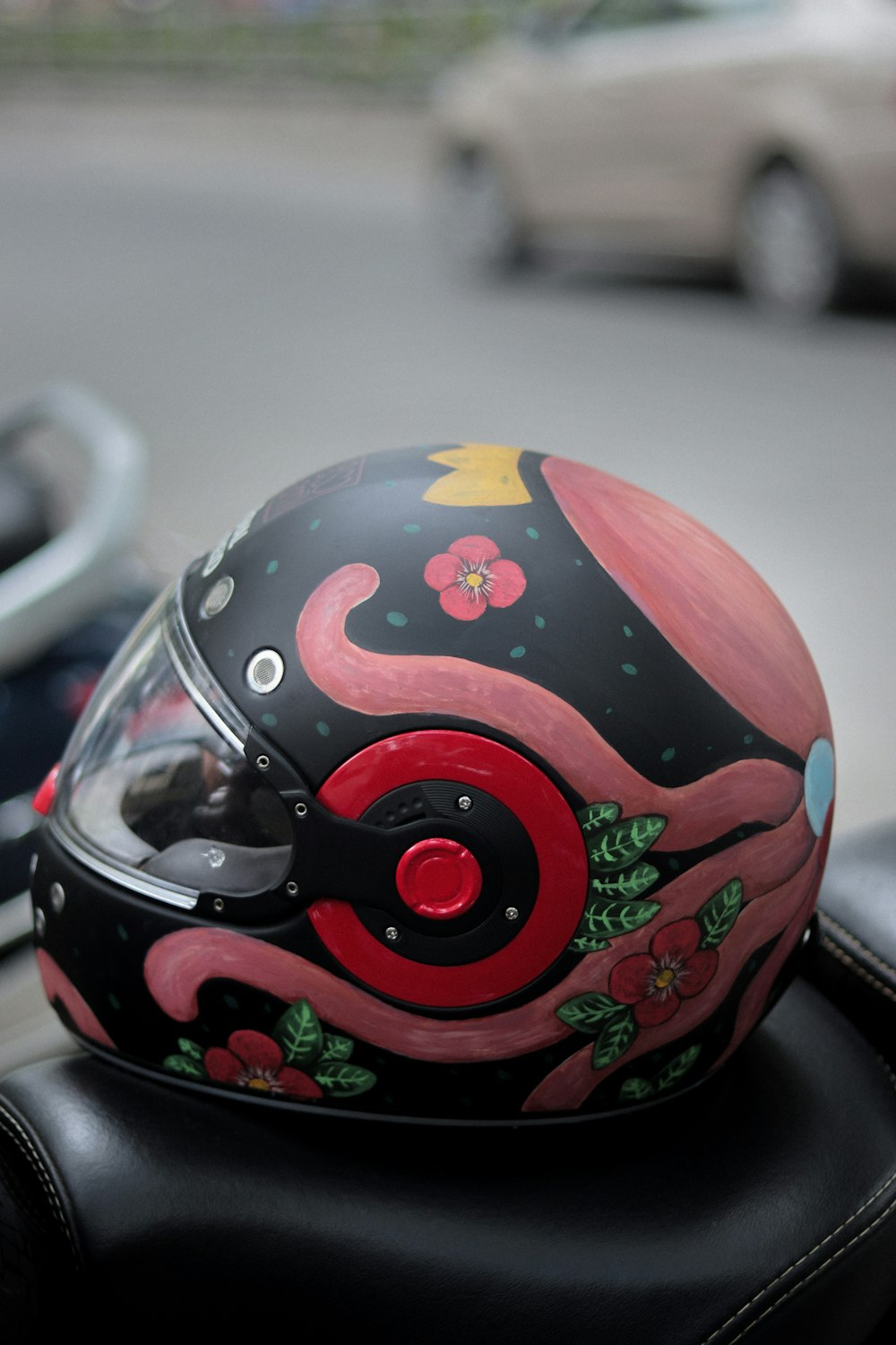 a helmet is sitting on the seat of a motorcycle