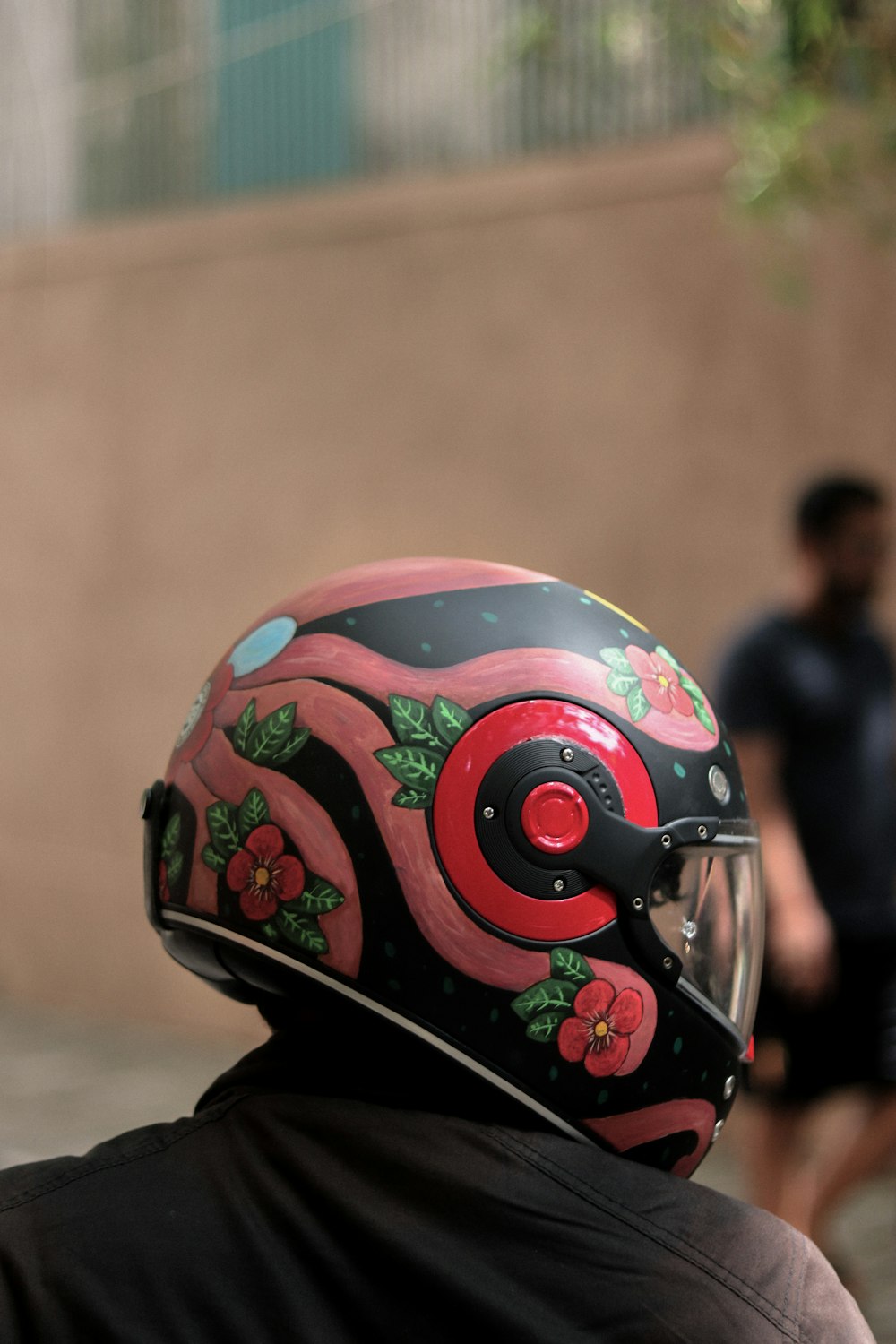 a person wearing a helmet with flowers on it