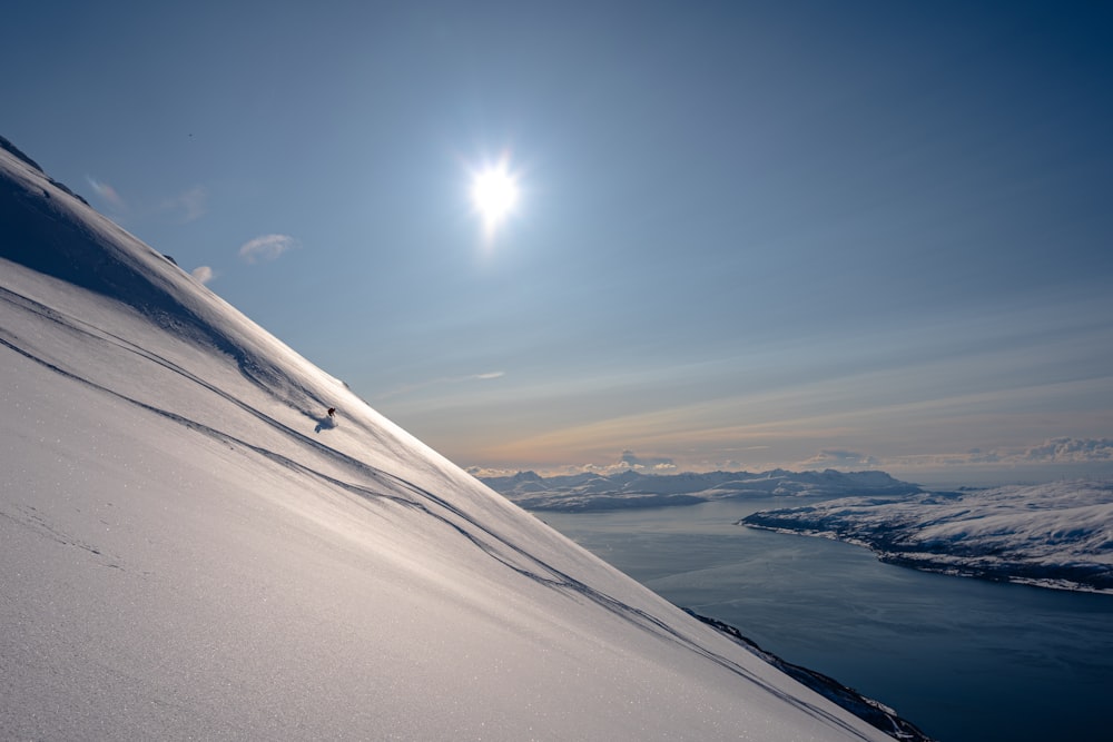 a person skiing down a snow covered mountain