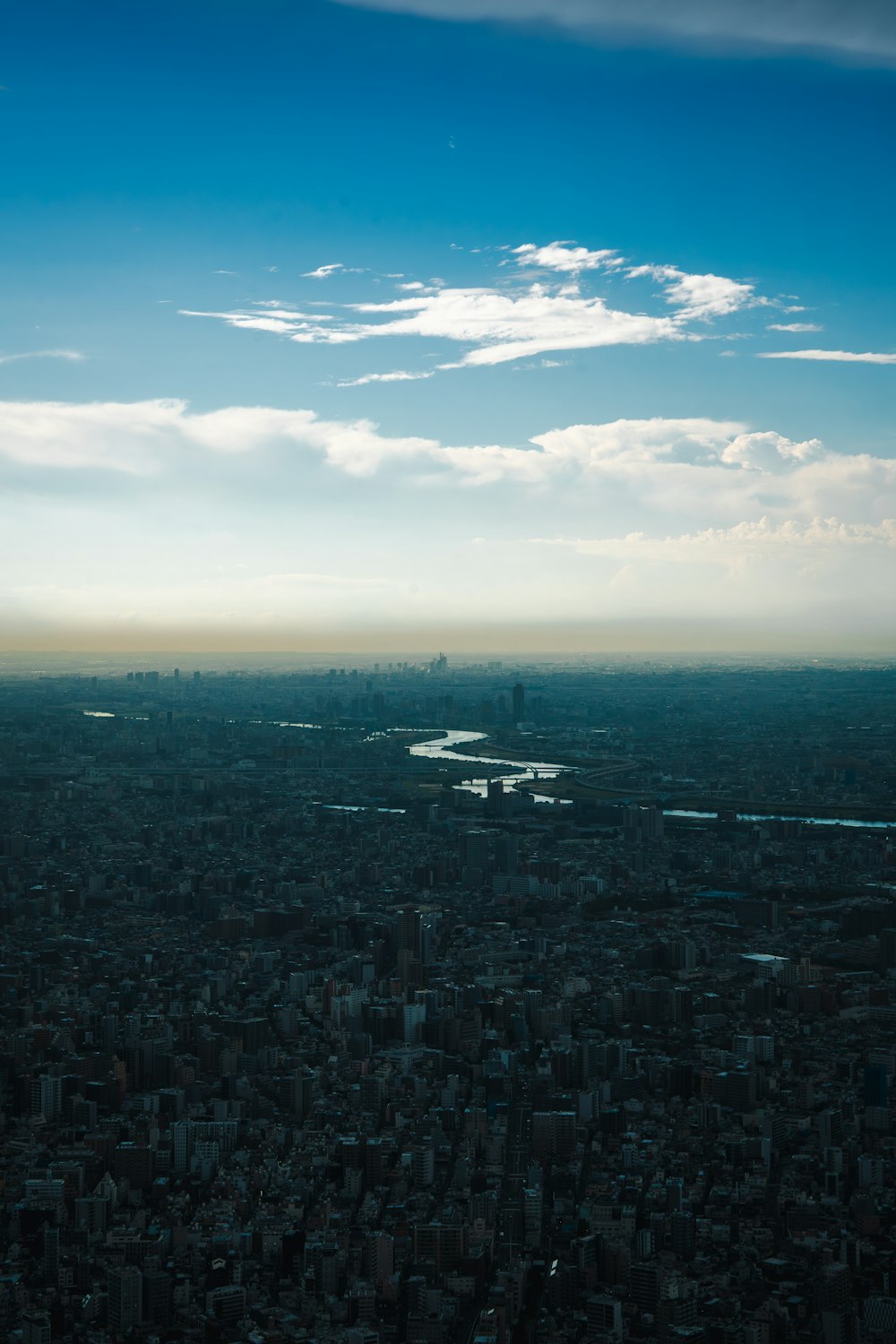 an aerial view of a city with a river running through it