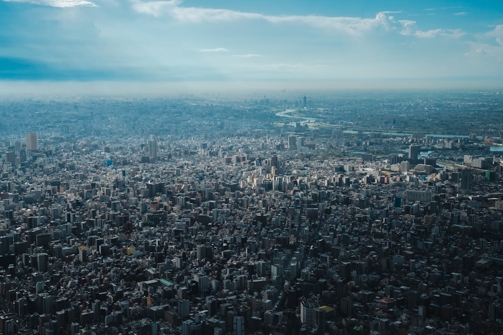 an aerial view of a city with tall buildings