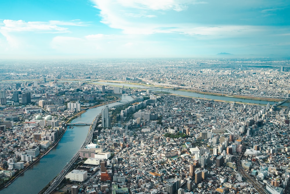 an aerial view of a city with a river running through it