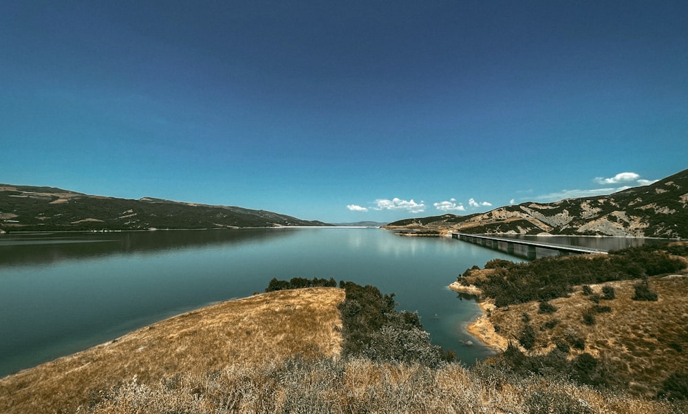 a large body of water surrounded by mountains