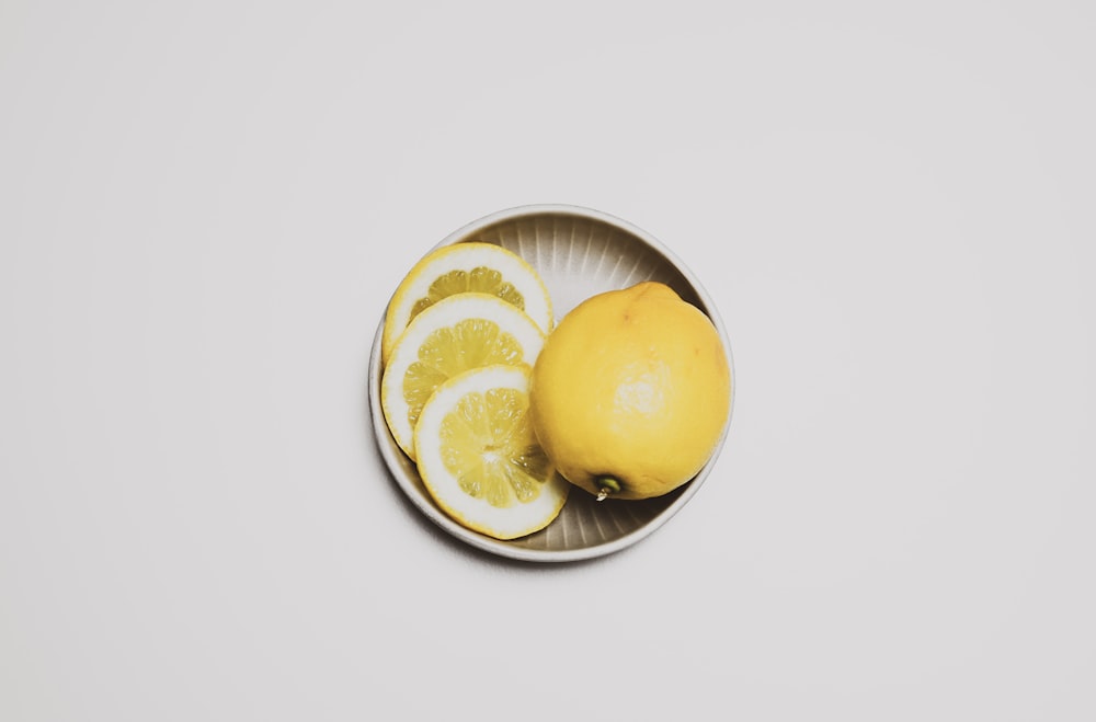 two lemons and a lemon on a plate