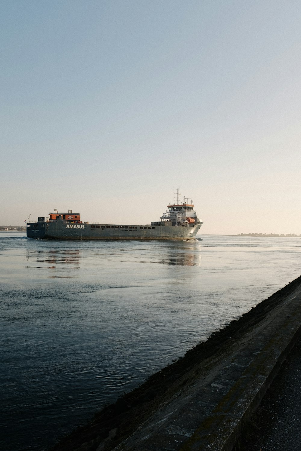 a large cargo ship in the middle of a body of water