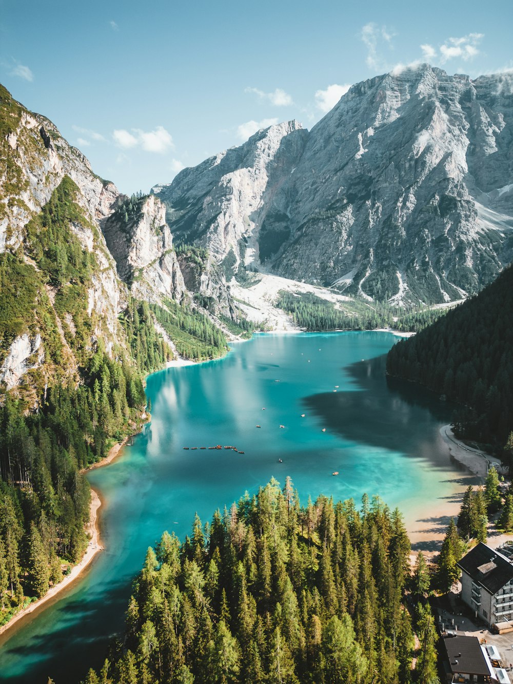 a lake surrounded by mountains and trees