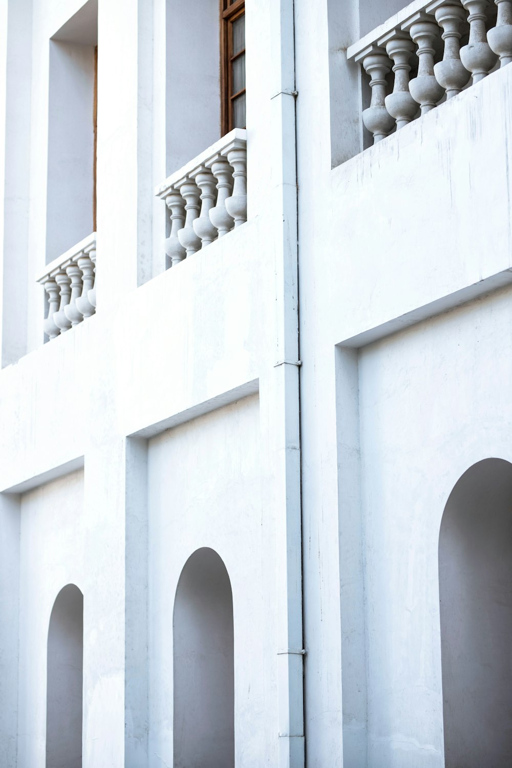 a white building with a clock on the front of it