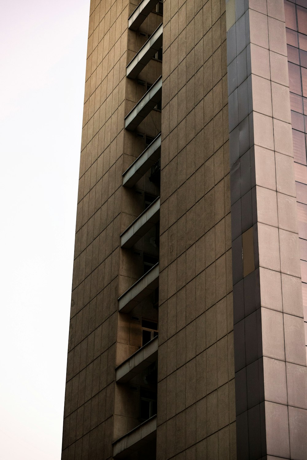 a tall building with a clock on the side of it