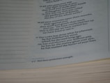 Text from a book, with a passage likely from a religious or spiritual context. The text includes verses numbered 16 and 17, talking about enemies, God's planning, and fulfillment of His word. The text also includes a footnote at the bottom.