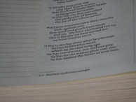 Text from a book, with a passage likely from a religious or spiritual context. The text includes verses numbered 16 and 17, talking about enemies, God's planning, and fulfillment of His word. The text also includes a footnote at the bottom.