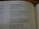 An open book displaying a passage from the Old Testament with text that discusses prayer, grief, and lamentation. The book is laid flat, and the focus is on the content, highlighting verses with emotional and religious themes.