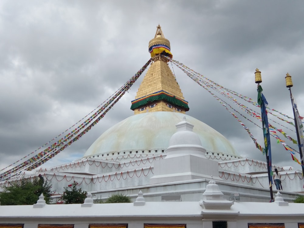 a large white building with a gold dome