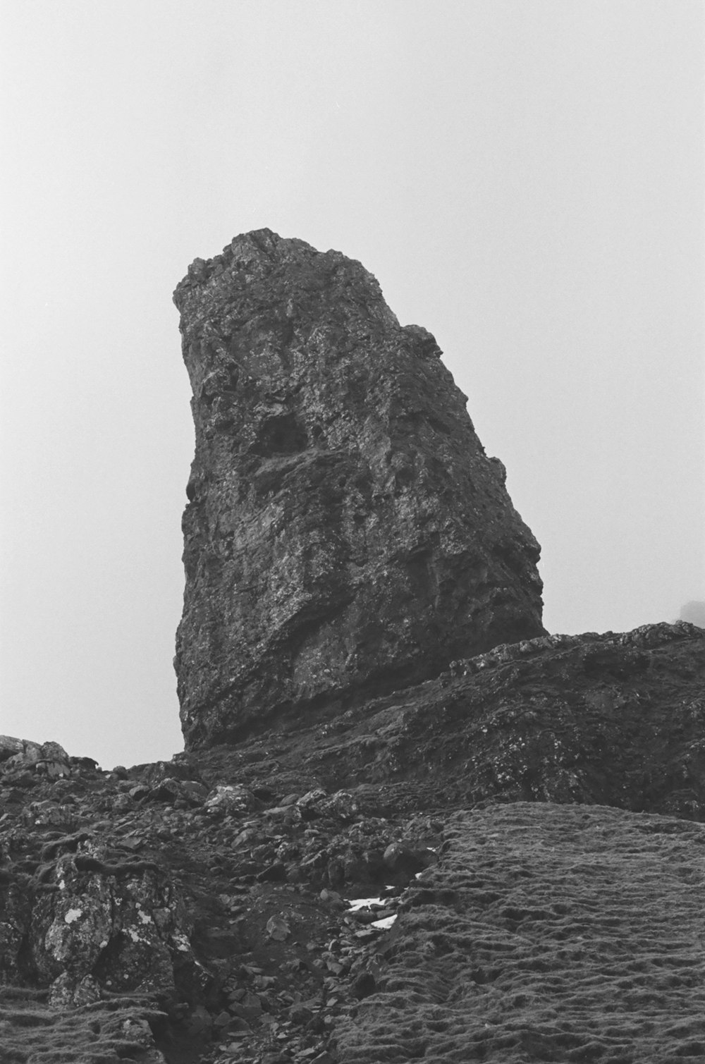 a black and white photo of a rock outcropping