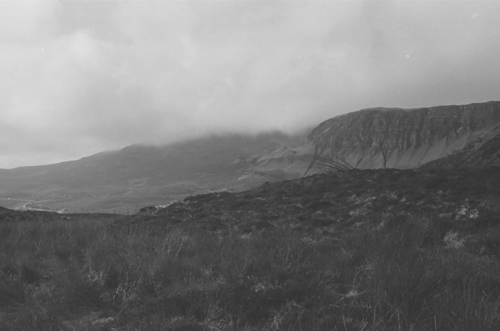 a black and white photo of a mountain range