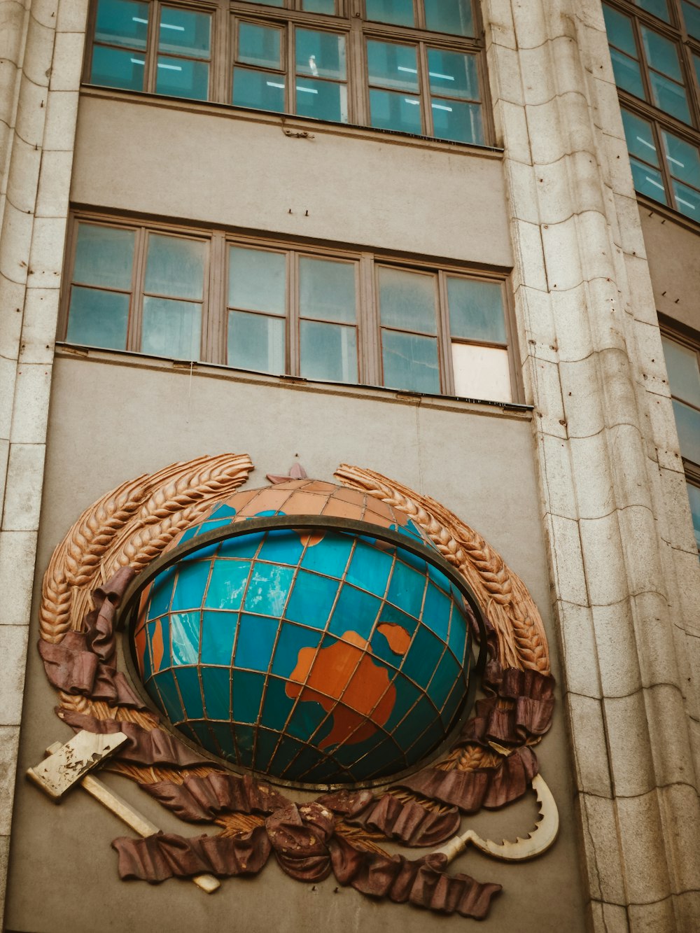 a building with a large globe on the front of it