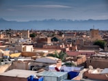 Panoramic aerial shot of Isparta's cityscape with mountains in the background.