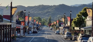 a small town with a mountain in the background