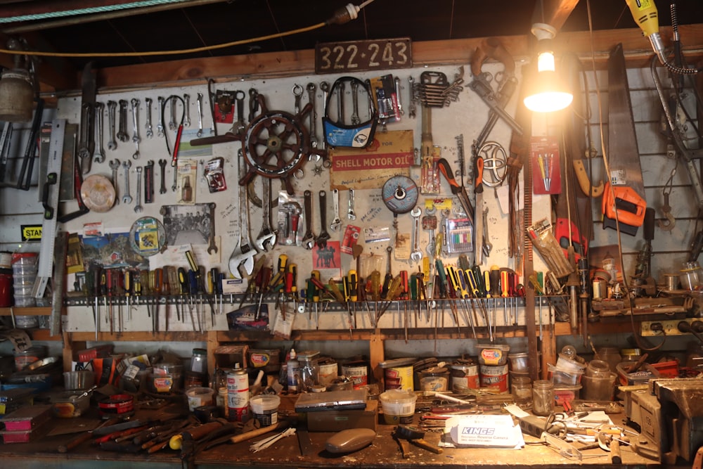 a room filled with lots of tools and a light