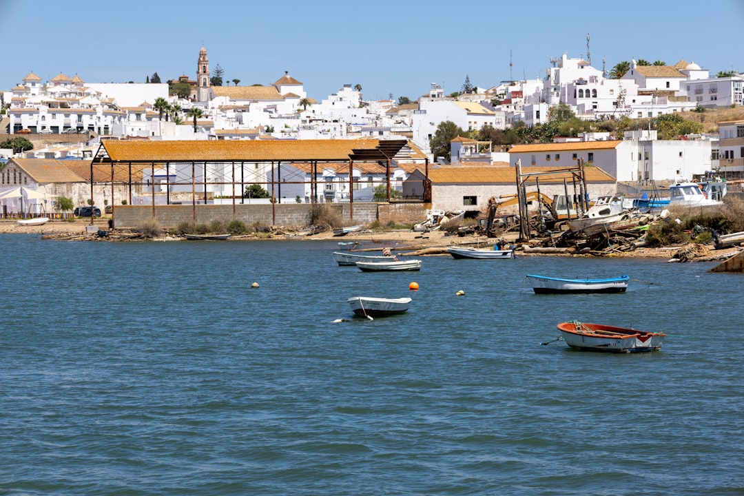 a group of boats floating on top of a body of water, Ayamonte Spain harbour