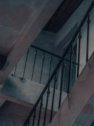 Close-up of a sturdy steel staircase with black and red accents.