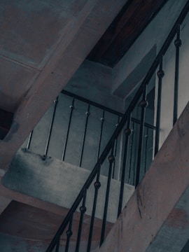 Close-up of a sturdy steel staircase with black and red accents.