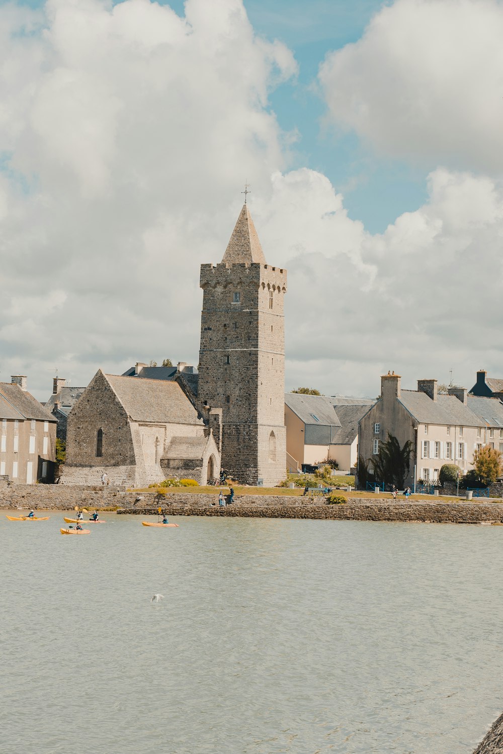 a large building sitting next to a body of water