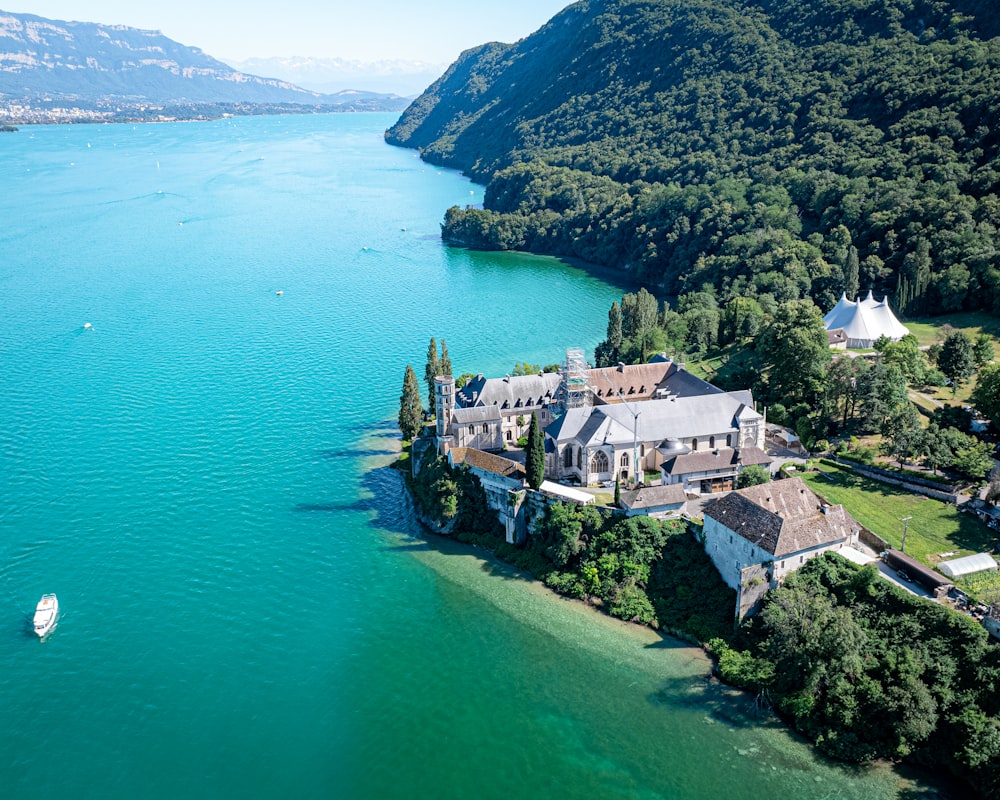 an aerial view of a house on a lake