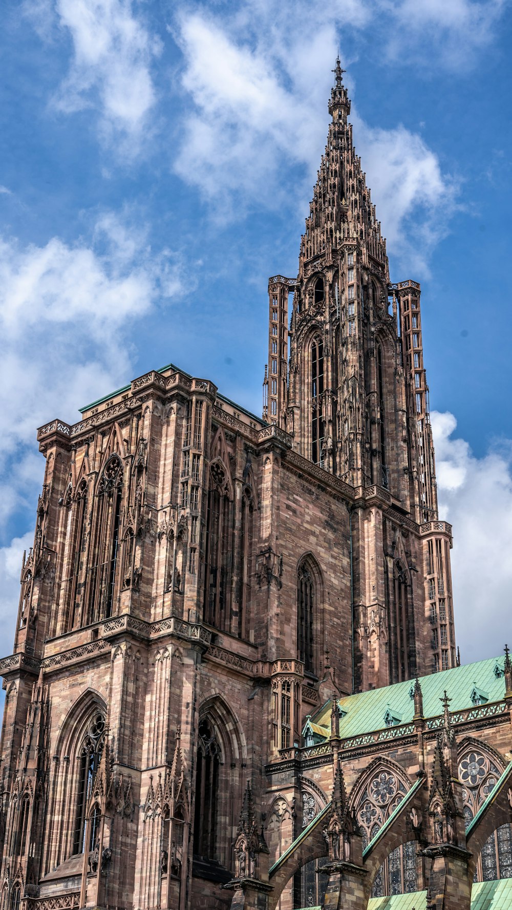 a very tall cathedral with a clock on it's side