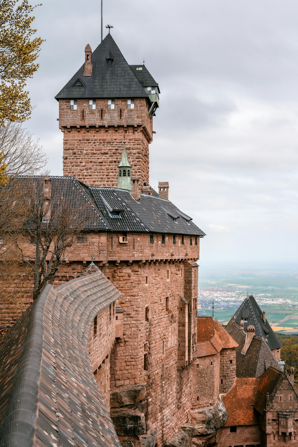 a tall brick tower with a clock on top of it