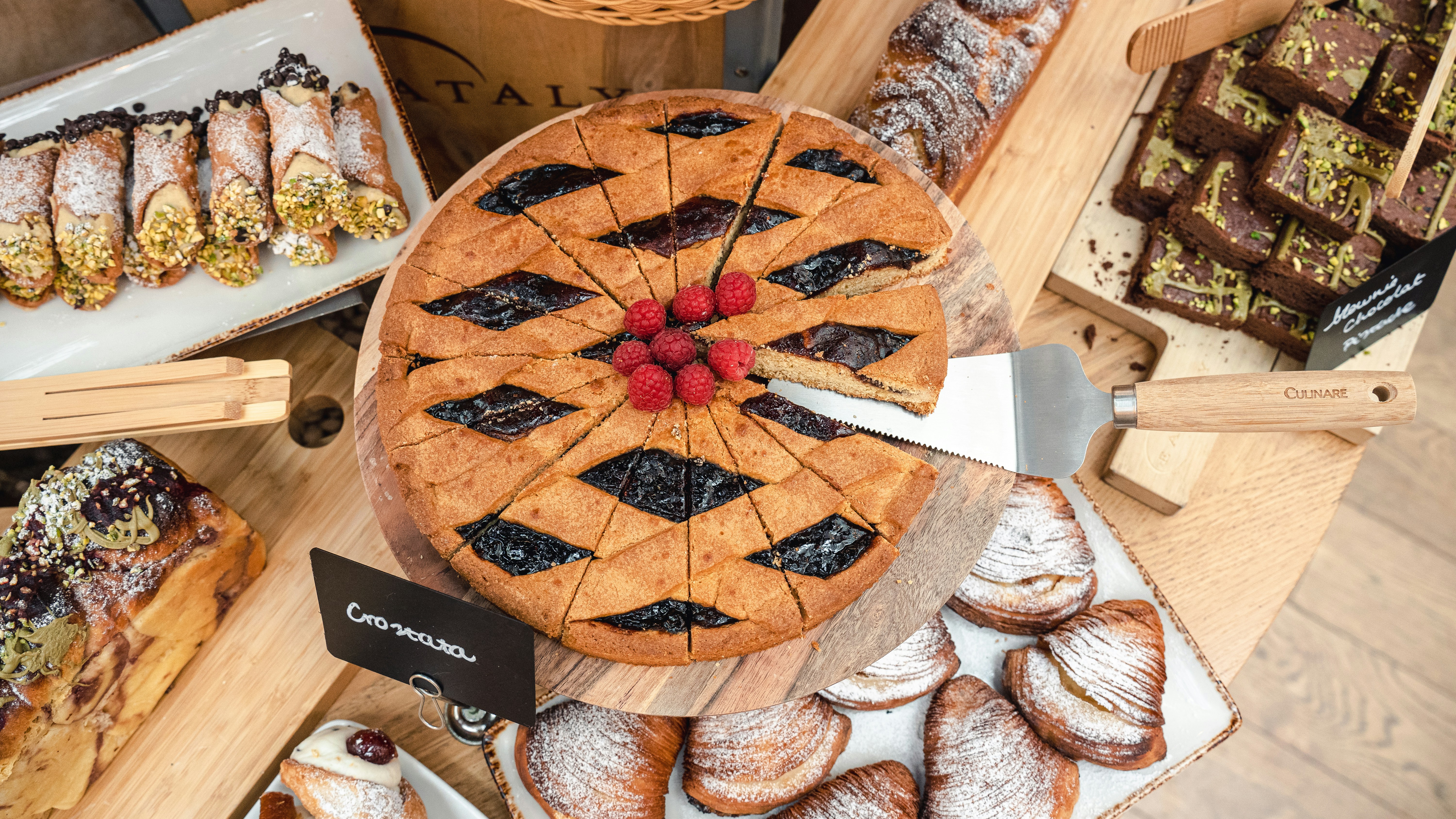 a table topped with lots of different types of pastries