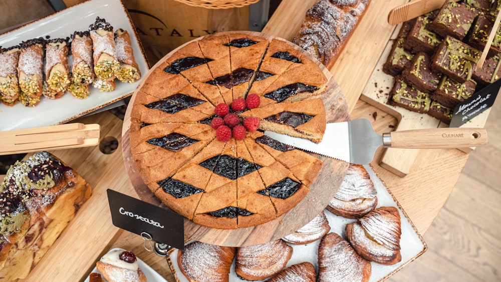 a table topped with lots of different types of pastries