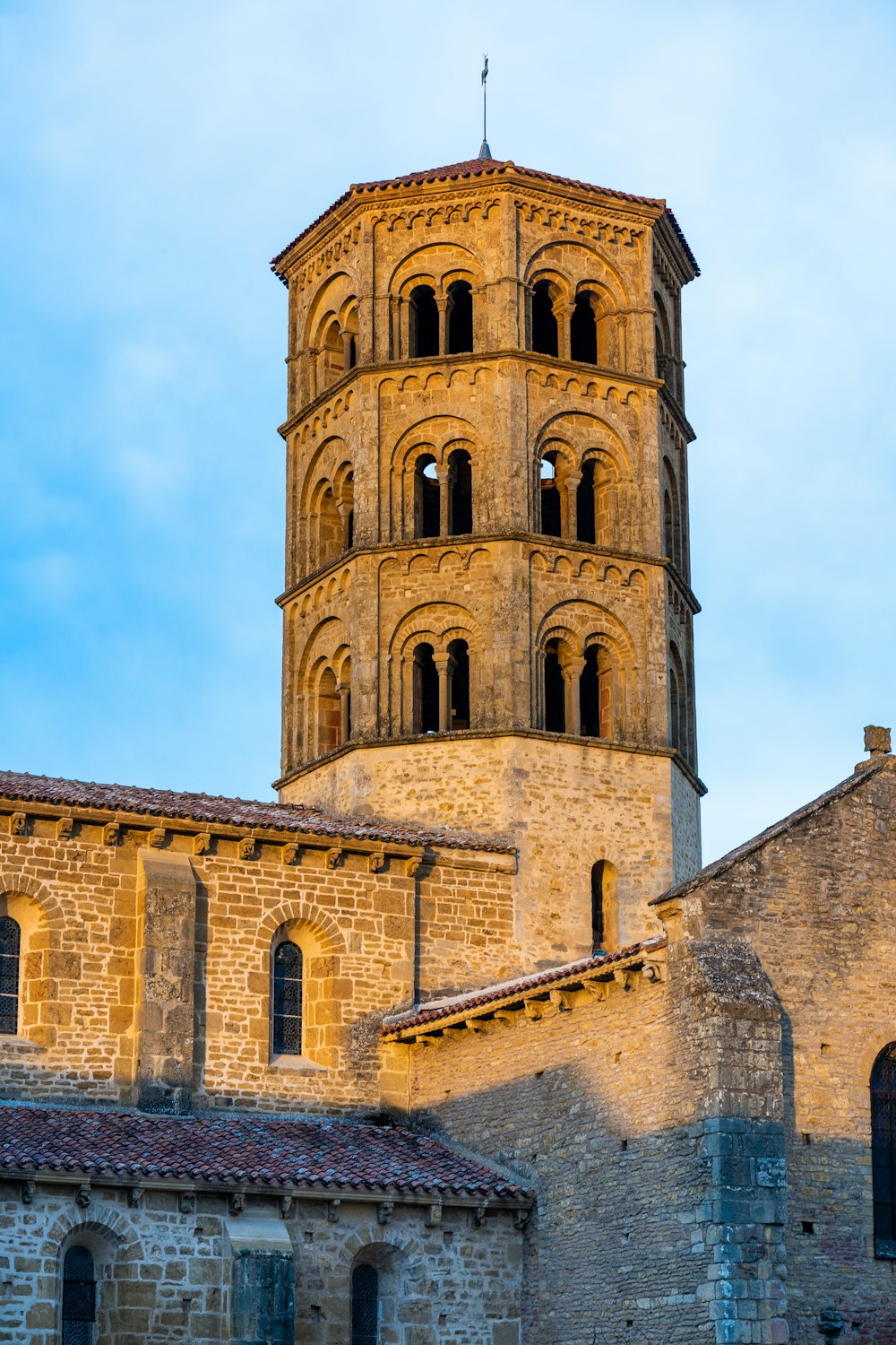 a tall tower with a clock on the top of it