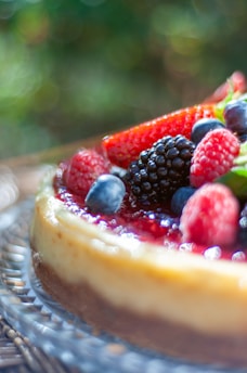 a fruit tart on a plate on a table
