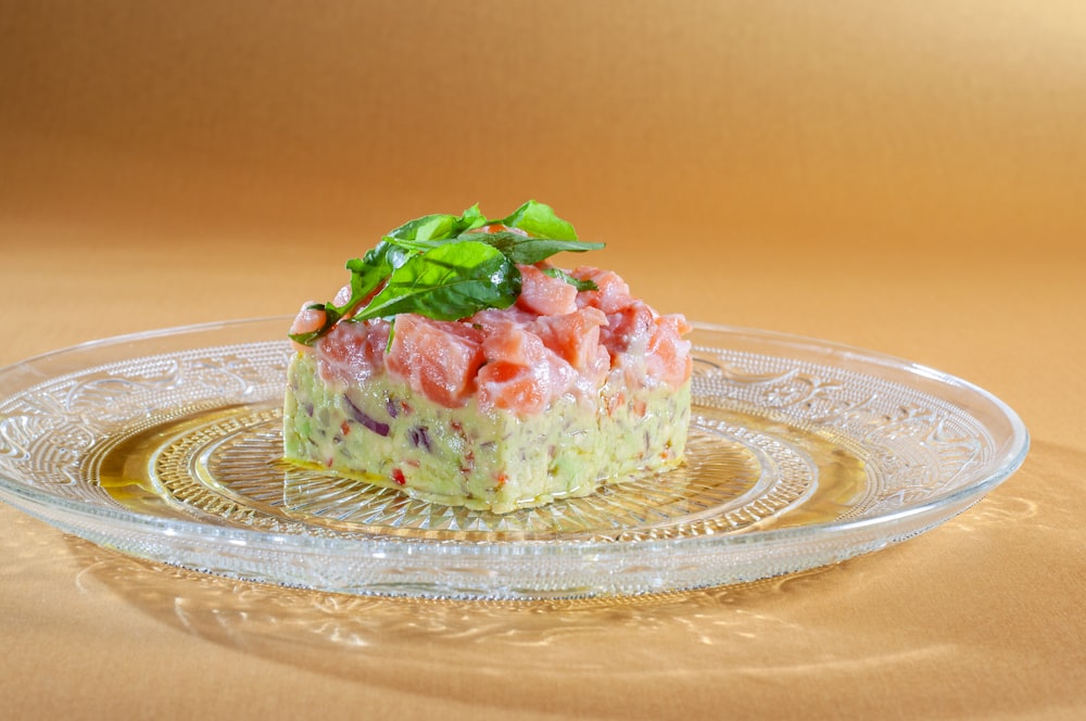 a piece of cake sitting on top of a glass plate