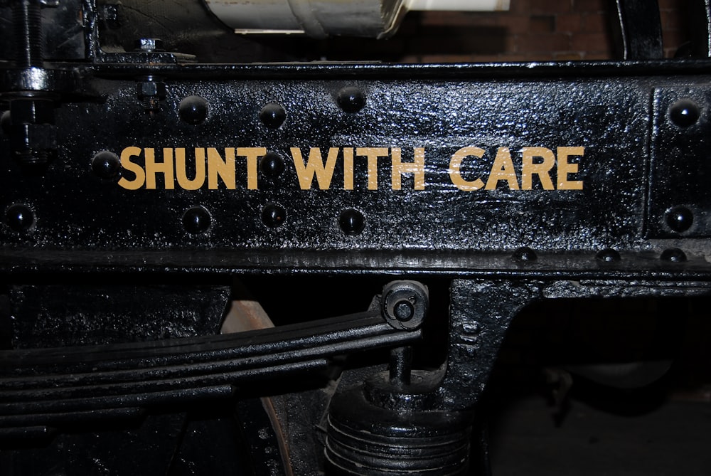 a close up of a machine with the words shut with care on it